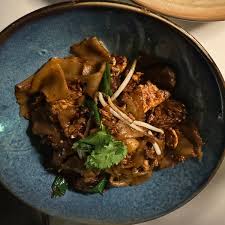 XO Brasserie signature dishes Steak Chow Fun, Crab Rangoon, Chilean Sea Bass, Pot Stickers, Salt and Pepper Shrimp